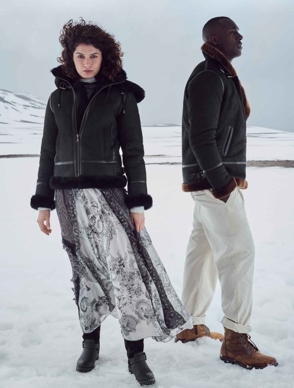 Couple wearing sheepskin coats - click to shop now
